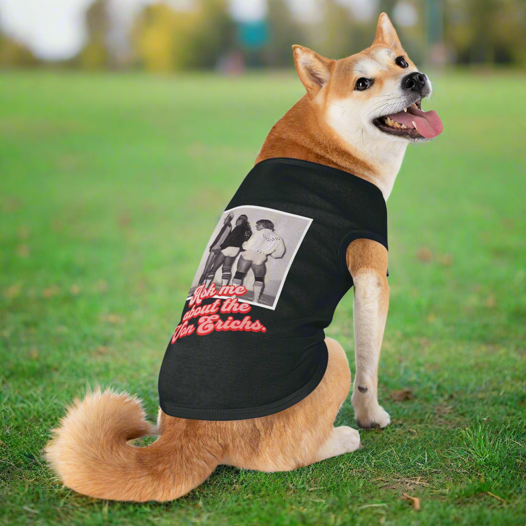 Dog in grass wearing a Von Erich shirt